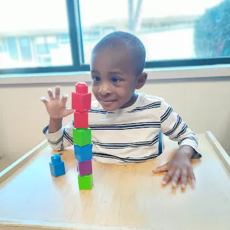 Aiden working on a puzzle in occupational therapy