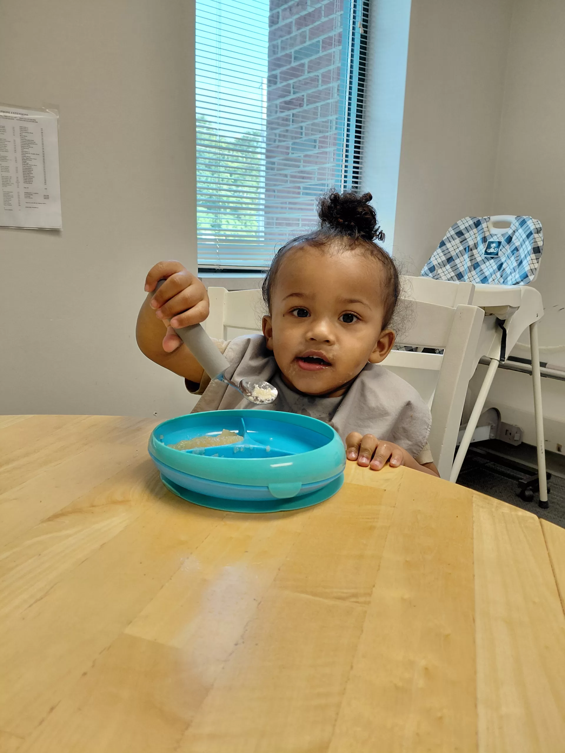 Jalen practicing self-feeding skills