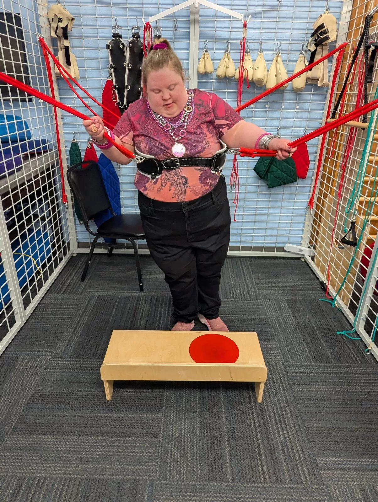Patient using the Spider Cage universal exercise unit during physical therapy
