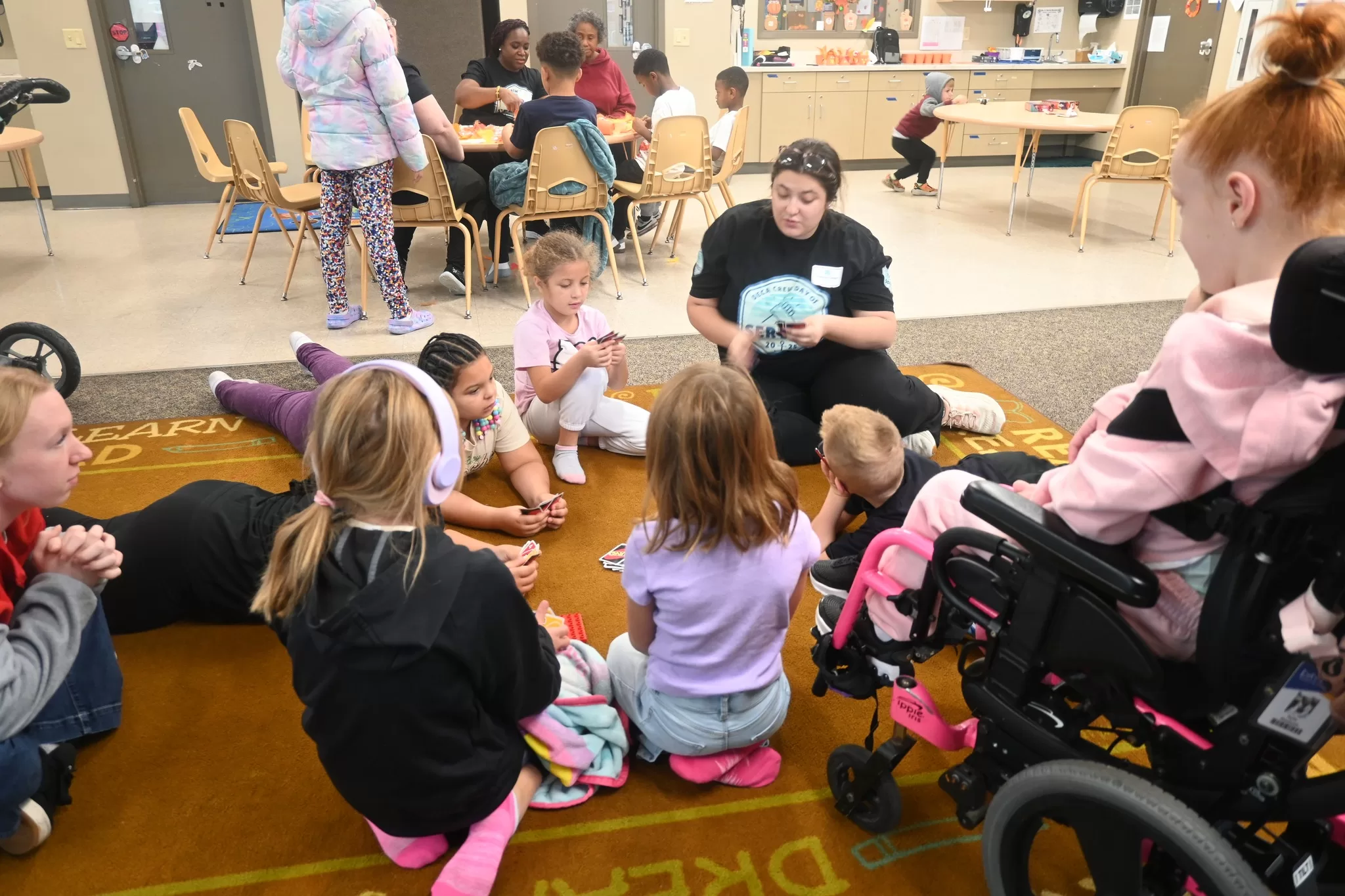 Volunteer reading with children